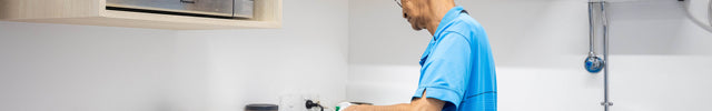 Commercial_cleaner_cleaning_kitchen_in_New_Plymouth